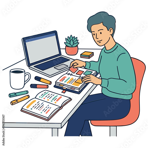 A man sitting at a desk working on colorful papers with a laptop and books nearby