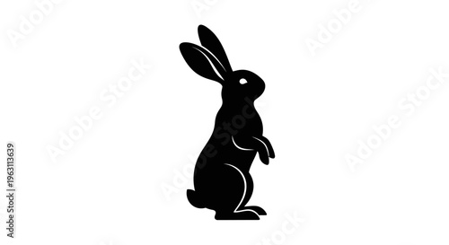 Elegant Black Rabbit Silhouette Standing Upright on White Background.