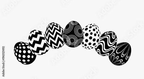 Black and white patterned Easter eggs arranged in an arc.