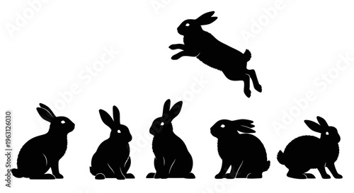 Collection of black rabbit silhouettes in various poses, including one jumping.