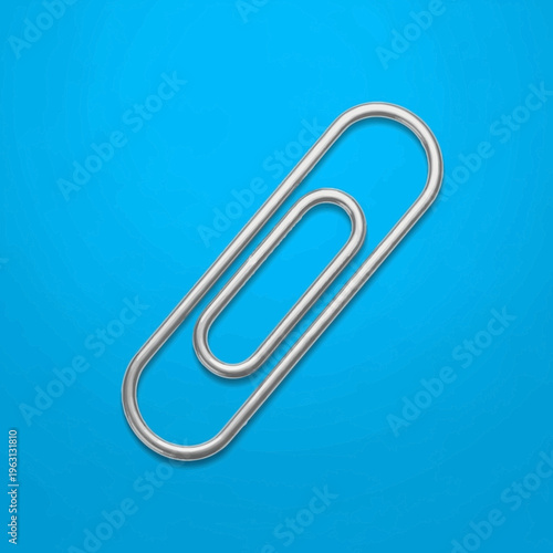 Silver metal paper clip office supply.