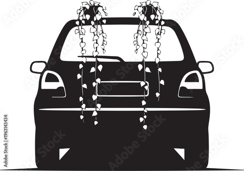 Black silhouette of a car with hanging plants on the back