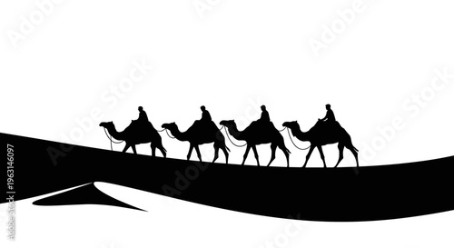 Camels walking on sand dune.