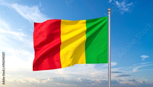 The National Flag of Guinea Waving Proudly Against a Blue Sky with Clouds.