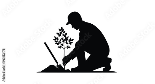 Man planting a tree in the ground with a shovel in a kneeling position outside