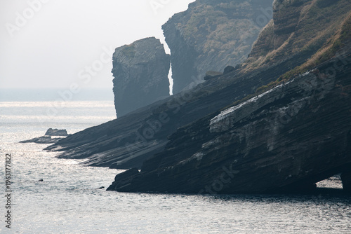 idyllic overcast seascape with cliff in Udo Island, South Korea