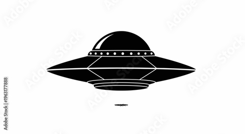 Black silhouette of a UFO flying saucer spacecraft isolated on white