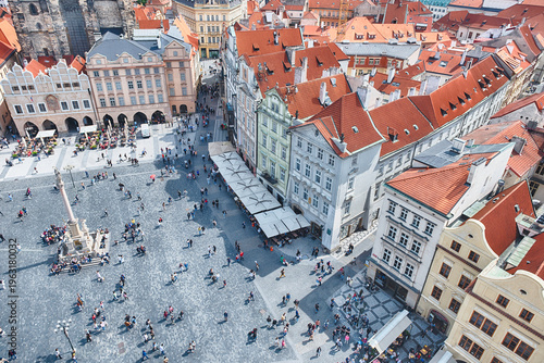 Tourists walking in busy old town square, Prague, Czech Republic