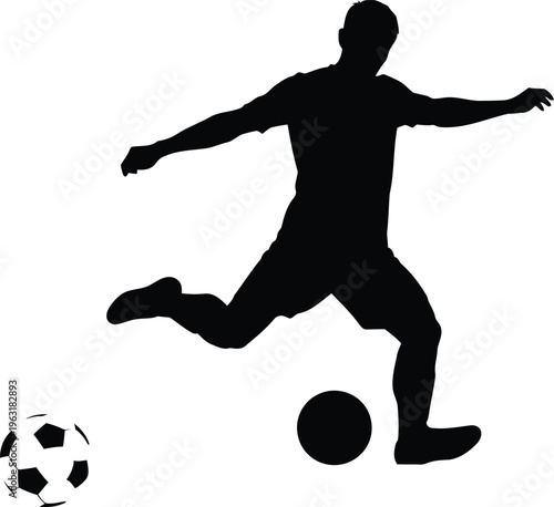 Silhouette of a soccer player kicking a ball, action shot of sports and game