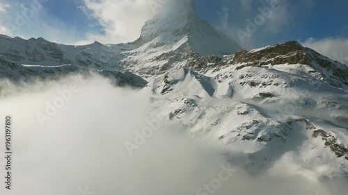 Pedestrians walking on Zermatt village main street in winter Switzerland