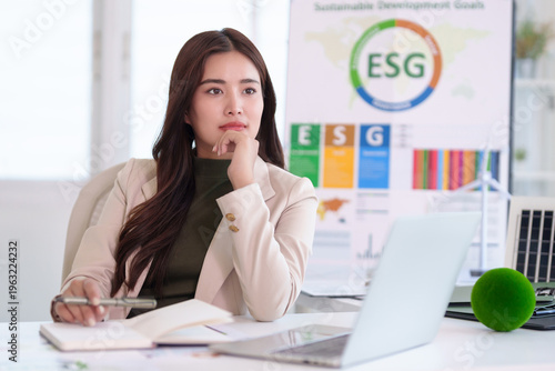 Canvas Print Asian adult business woman planning sustainable ESG strategy developing corporat