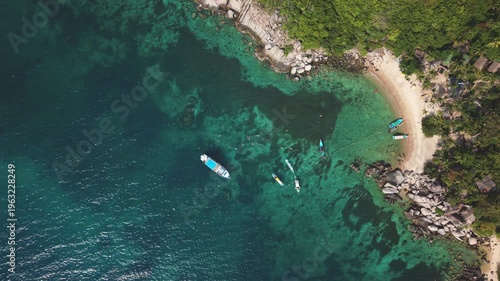 Aerial View of Hidden Bay with Longtail Boats Ko Tao Thailand