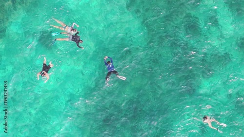 Top Down Aerial Close-Up of Snorkelers in Turquoise Water Ko Tao Thailand