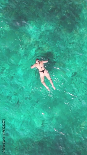 Vertical Top Down Aerial View of Snorkelers in Turquoise Water Ko Tao Thailand