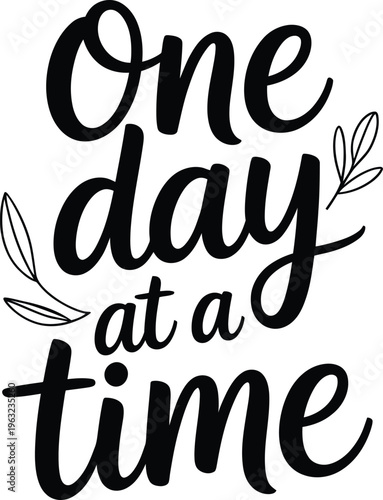 Handwritten quote one day at a time in black ink on white background