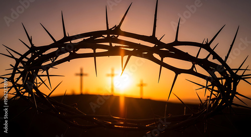 Crown of thorns with blood drop and three crosses at sunset