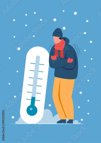 Person shivering standing by a low temperature thermometer