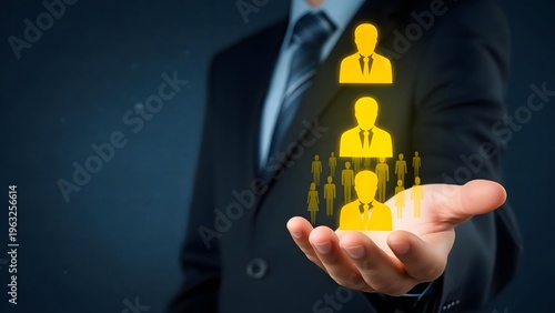 A businessman in a suit holding a glowing yellow icon of people on his hand on transparent background