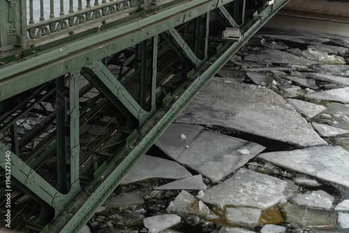 Winter in Saint Petersburg with ice on the river under a bridge