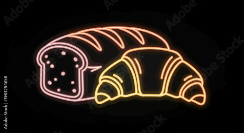 Neon sign of bread and croissants in a bakery window at night