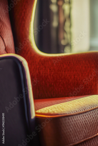 A chair sits in front of a window with natural light pouring in