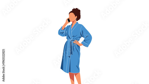 Young woman in comfortable blue bathrobe talking on mobile phone while standing against plain white background during her morning routine.