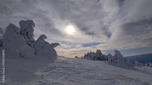 Snowy landscape on the mountain on a sunny day, ski holiday concept.