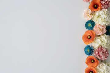 Colorful flowers border on light gray background for decoration and design  elegant floral arrangement