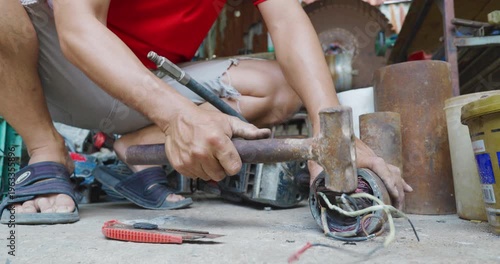 Business industry man hand fix electric motor tool in home business DIY