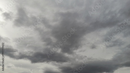 Dramatic dark storm clouds gathering in a moody gray sky before rain