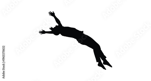 Silhouette of a person snorkeling or scuba diving in the ocean with fins and mask exploring underwater world