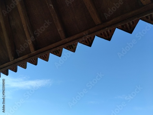 Gazebo roof detail in outdoor setting, classic wooden pavilion structure.