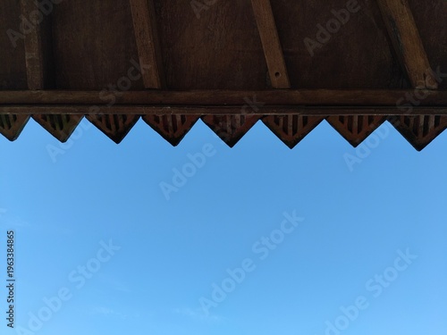 Gazebo roof detail in outdoor setting, classic wooden pavilion structure.