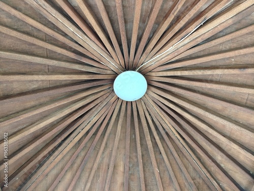 Gazebo roof detail in outdoor setting, classic wooden pavilion structure.