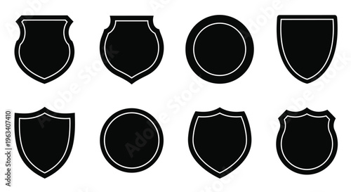 Collection of black shield shapes and badges on a white background