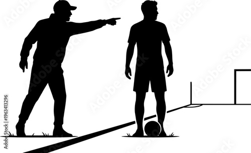 Soccer coach instructing player on field during game or practice