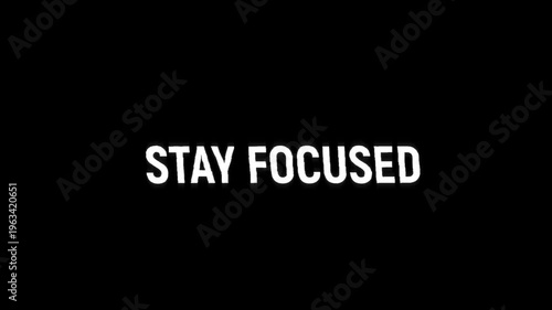 stay focused text glitch error animation with a vintage noise effect. seamless looped text typography animated 4k video stay focus glitch on black background