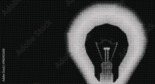 Halftone light bulb on dark textured background with white glow