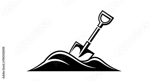 Shovel digging into pile of dirt.