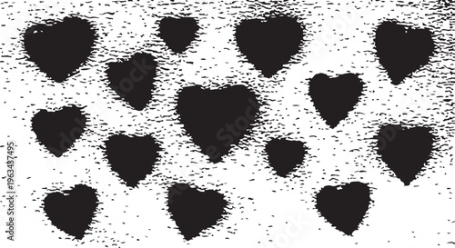 A collection of black heart silhouettes featuring a heavy spray-paint or stencil effect on a white background.