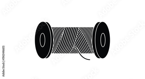 Black spool of thread with intricate winding a striking silhouette