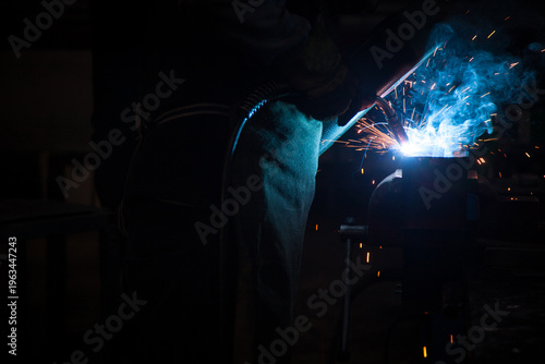 A professional industrial TIG welding machine with torch and digital display, isolated on a white background for manufacturing and engineering.