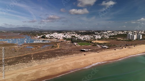 Drone Pan Out Over Vast Alvor Beach and Scenic Shoreline in Algarve Portimao Portugal
