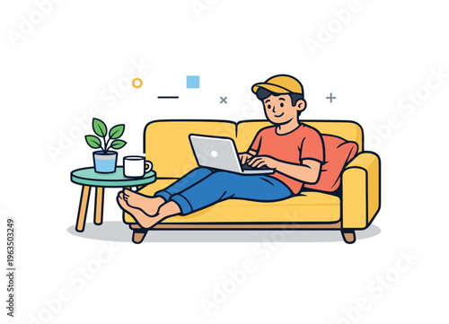 Young man relaxing on a yellow couch while working on his laptop