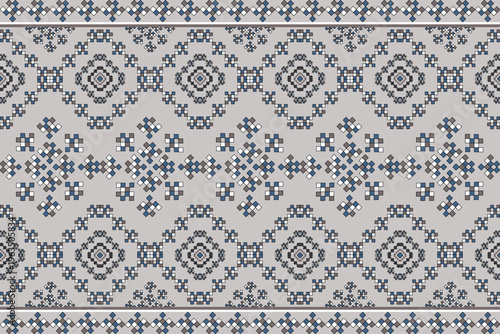 Seamless geometric textile pattern with pixel-style motifs in blue, gray, and black on a light background. Traditional cross-stitch inspired design for fabric, wallpaper, or decoration.