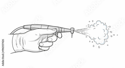 Gloved hand holding dental drill spraying mist