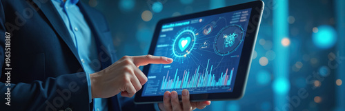 Person in suit uses tablet with health data analytics dashboard. Shows charts graphs. Heart icon medical data. Technology for healthcare management.