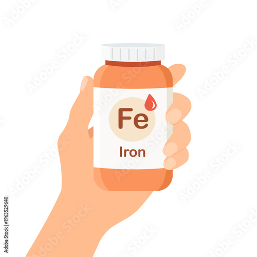 Iron supplement bottle in hand. Fe vitamin, iron deficiency