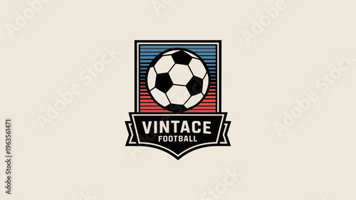 A vintage style emblem features a classic black and white soccer ball centered within a red and blue striped shield shaped frame high quality professional detailed