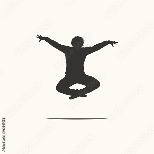 Silhouette of a person jumping with arms wide open and legs crossed, symbolizing freedom, lightness, and levitation.